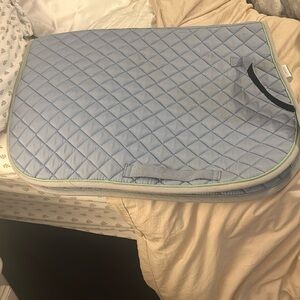 Dover brand pony size light blue saddle pad with green and grey trimming